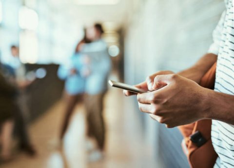 Student holding smartphone